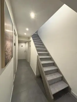 a staircase in a house with a stair case at Résidence Gambetta in Cannes