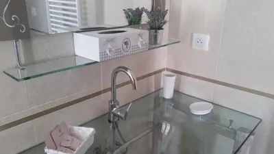 a bathroom with a sink with a faucet and a mirror at B&B Villa Blanche in Cannes