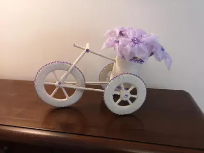 a toy bike with a flower on top of a table at B&B Villa Blanche in Cannes