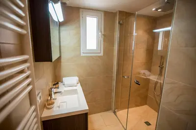 a bathroom with a shower and a sink at Imperial Apartment by Connexion in Cannes