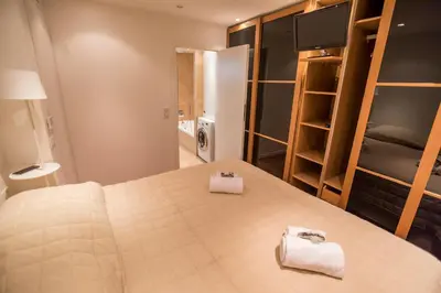 a bedroom with a bed with two towels on it at Imperial Apartment by Connexion in Cannes
