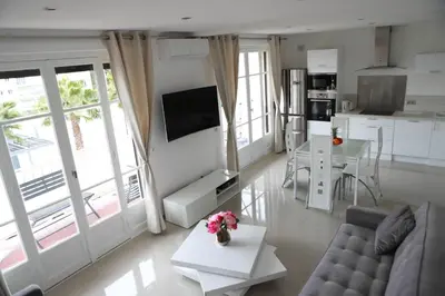 a living room with a couch and a table at 3P lumineux rénové derrière la Croisette in Cannes