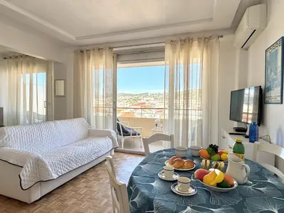 a living room with a table with fruit on it at Ibis Studio 5380 in Cannes