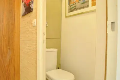 a bathroom with a white toilet in a room at Résidence Gray d'Albion Studio LOU511 in Cannes