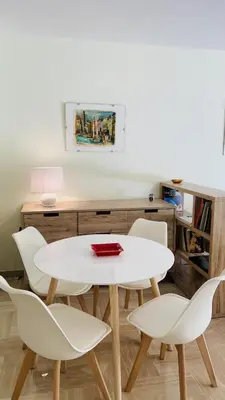 a white table and chairs in a room with a desk at Résidence Gray d'Albion Studio ROU503 in Cannes
