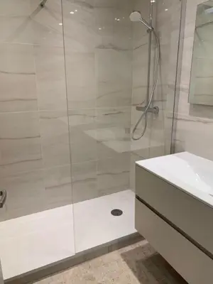 a bathroom with a glass shower and a sink at Résidence Gray d'Albion Studio ROU503 in Cannes
