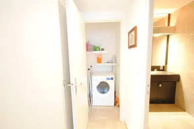 a laundry room with a washer and dryer at Résidence Gray d'Albion 2P LIU5376 in Cannes