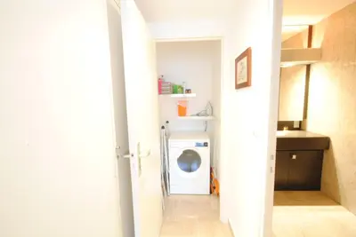 a laundry room with a washer and dryer at Résidence Gray d'Albion 2P LIU5376 in Cannes