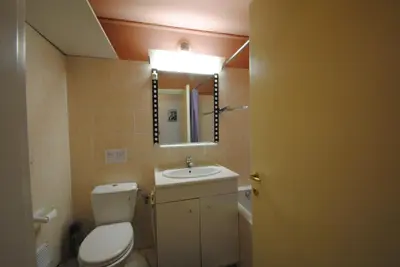 a bathroom with a toilet and a sink and a mirror at Les Serbes 2P RET29 in Cannes
