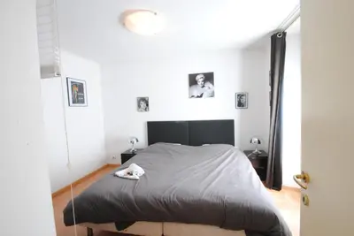 a bedroom with a bed in a white room at Les Serbes 2P RET29 in Cannes