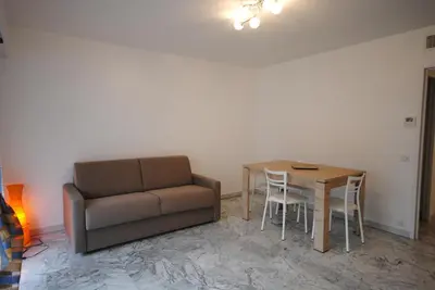 a living room with a couch and a table at Le Minerve 3P DEB5515 in Cannes