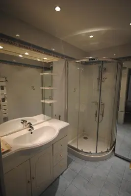 a bathroom with a sink and a shower at Le Minerve 3P DEB5515 in Cannes