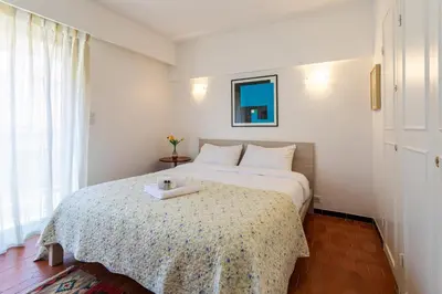 a bedroom with a bed with a tray on it at Le Minerve 3P DEB5515 in Cannes