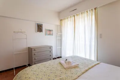 a bedroom with a bed with a towel on it at Le Minerve 3P DEB5515 in Cannes
