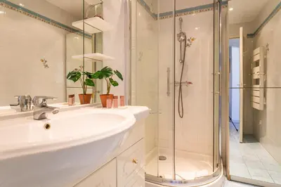 a bathroom with a sink and a shower at Le Minerve 3P DEB5515 in Cannes