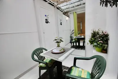 an empty room with a table and chairs in a room at Le Gambetta 2P 262 in Cannes