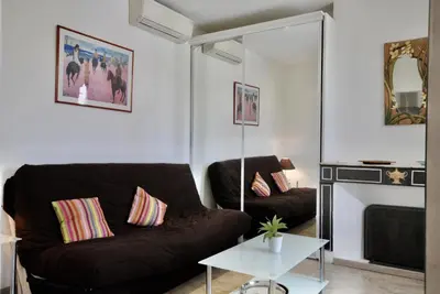 a living room with a couch and a table at Le Gambetta 2P 262 in Cannes
