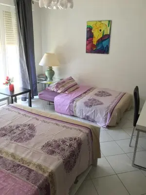 two beds sitting next to each other in a room at Studio Cannes la Croisette in Cannes