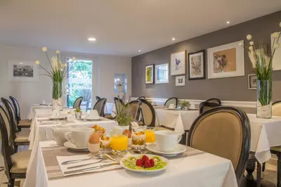 a kitchen counter with a sink and a microwave at La Bastide de l'Oliveraie in Cannes