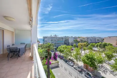 a balcony with a table and a view of a city at Apartment 2 bedrooms 2 bathrooms clear view in Palm beach area in Cannes