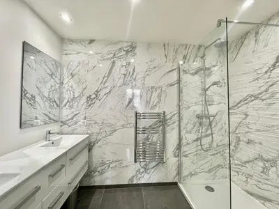 a white bathroom with a shower and a sink at Jaurès Home by Welcome to Cannes in Cannes