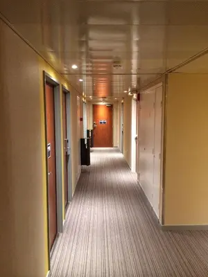 a hallway of an office building with a long corridor at ibis budget Cannes Centre Ville in Cannes
