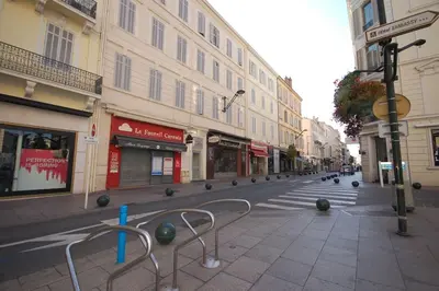 an empty street in a city with buildings at keep in touch 2 CHAMBRES AVEC TERRASSE ET GARAGE in Cannes