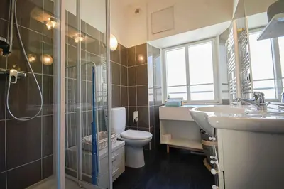 a bathroom with a toilet and a sink and a shower at keep in touch 2 CHAMBRES AVEC TERRASSE ET GARAGE in Cannes