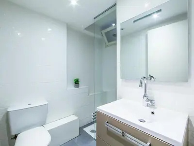 a bathroom with a toilet and a sink and a mirror at Apartment Le Corsaire-5 by Interhome in Cannes