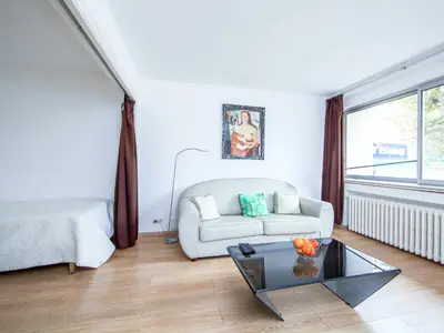 a living room with a couch and a table at Apartment Le Corsaire-5 by Interhome in Cannes