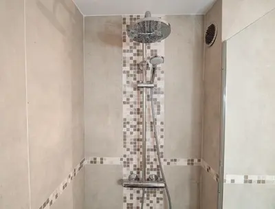 a shower in a bathroom with a glass shower head at Loft de standing Cannes in Cannes