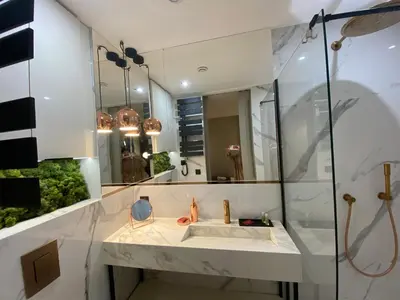 a bathroom with a sink and a mirror at Cannes cote sud in Cannes