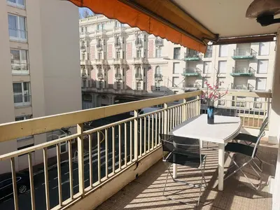 a balcony with a table and chairs on a balcony at One bedroom apartment in the center of Cannes, next to the Carlton, a few meters from the Croisette - 367 in Cannes