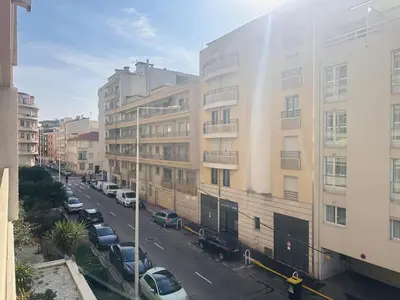 a view of a street with parked cars and buildings at One bedroom apartment in the center of Cannes, next to the Carlton, a few meters from the Croisette - 367 in Cannes