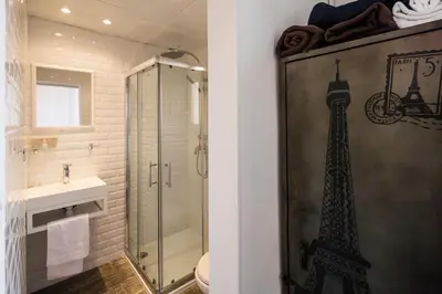 a bathroom with a shower and a toilet and a sink at Chanteclair in Cannes