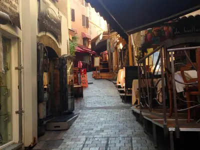 an alley with a stone walkway in a city at Chanteclair in Cannes