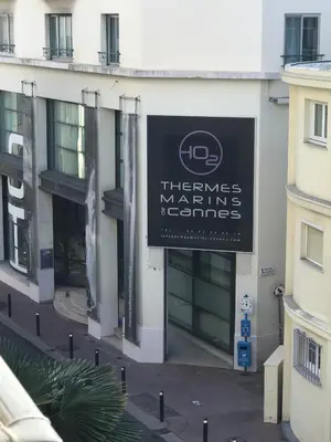 a sign on the side of a building at 3 pièces- Vieux port- Terrasse - Parking Possible in Cannes