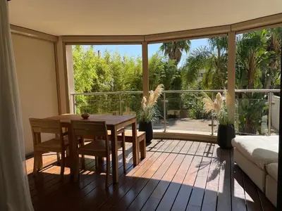 a room with a table and a large glass window at Cannes Villa St Barth in Cannes