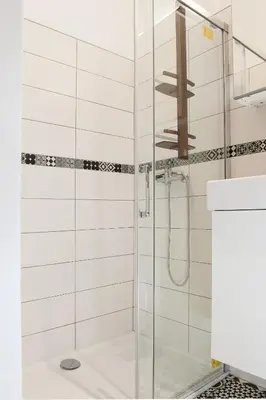 a bathroom with a shower with a glass door at #StudioCosy @ Center Cannes in Cannes