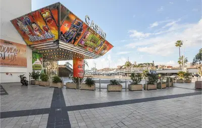 a building with a large sign on top of it at 1 Bedroom Lovely Apartment In Cannes in Cannes