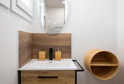 a bathroom with a white sink and a mirror at Place to beach - Bord de mer Croisette in Cannes