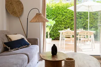 a living room with a couch and a table at Place to beach - Bord de mer Croisette in Cannes