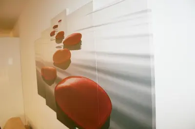 a red chair in a room with a wall at Bristol Park - parking - 5mn walk from Palais des Festivals in Cannes