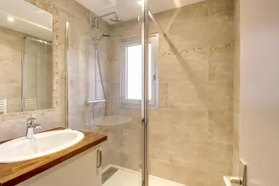 a bathroom with a sink and a shower at IMMOGROOM- Renovated - Wifi - Close to everything in Cannes
