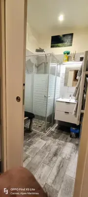 a bathroom with a sink and a mirror at La Petit Maison du Bonheur in Cannes