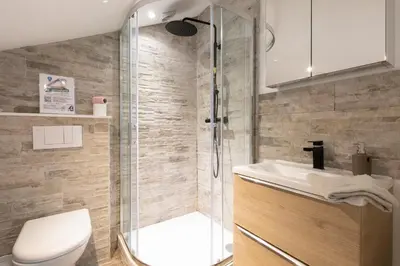 a bathroom with a shower and a toilet and a sink at Atelier & Galerie in Cannes