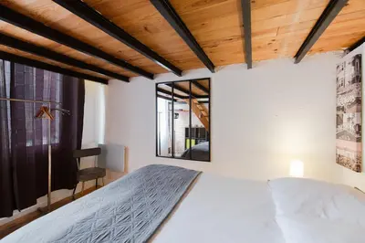 a bedroom with a bed and a window at Atelier & Galerie in Cannes