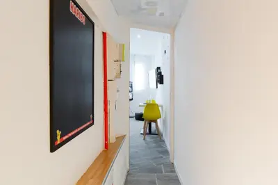 a hallway with a chalkboard on the wall at Atelier & Galerie in Cannes