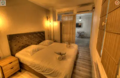 a bedroom with a bed with two bows on it at ALC - FF39 - 9 min Palais and Beaches in Cannes