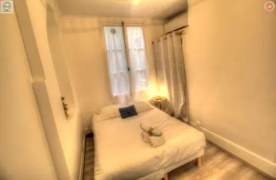 a small room with a bed and a window at ALC - FF39 - 9 min Palais and Beaches in Cannes